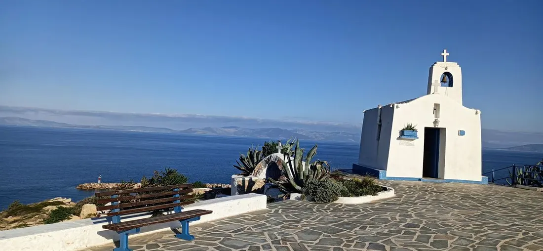 The whitewashed Agios Nikolaos chapel on the rocks above the Aegean at Rafina